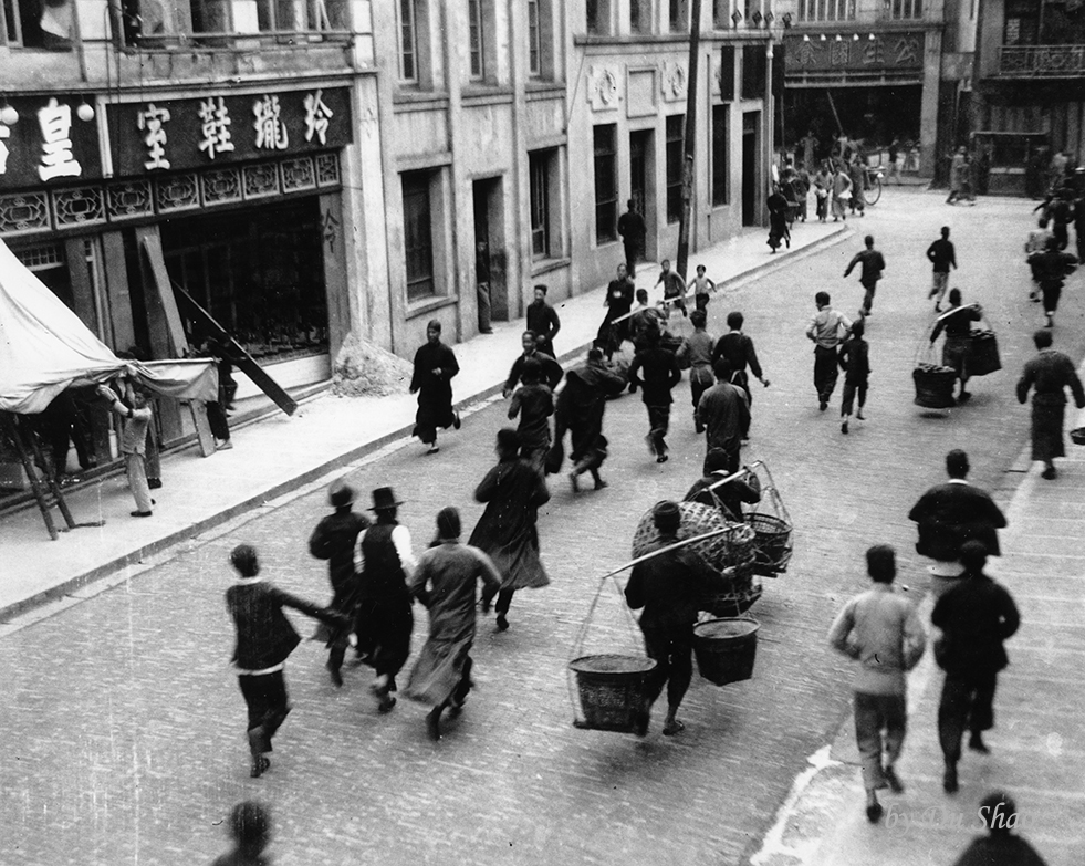 People running for shelter when Japanese bombers flew over the city in 1938